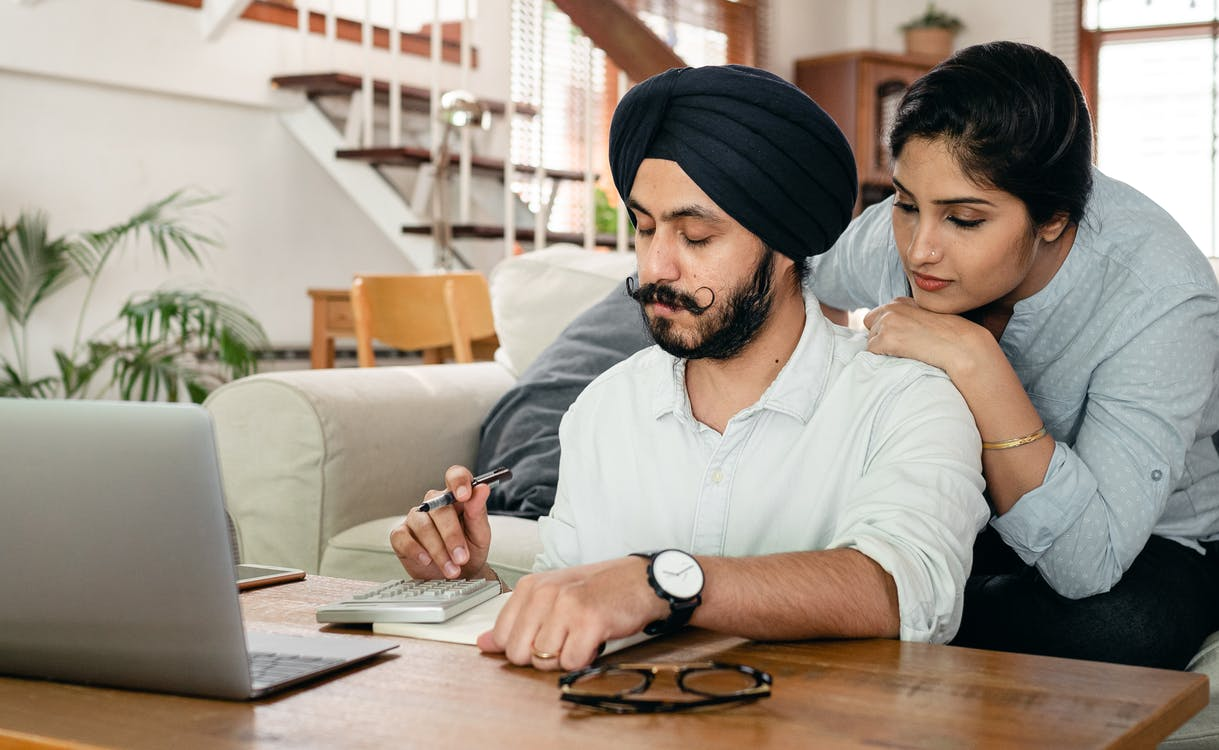 Couple calculating taxes