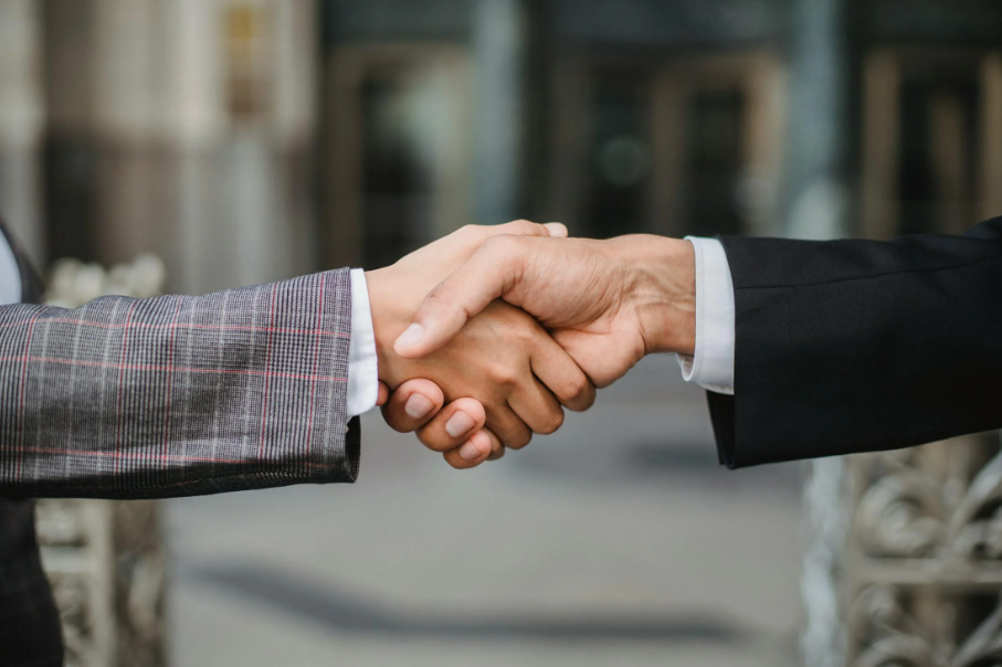 Business professionals shaking hands.