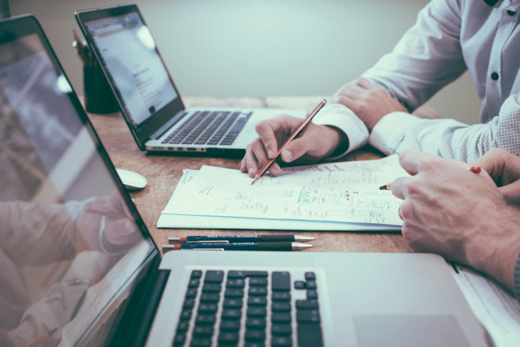 two individuals working on a document