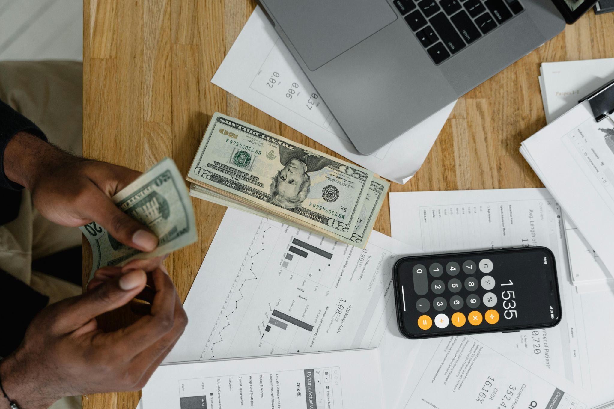 Cash and calculator arranged on the table