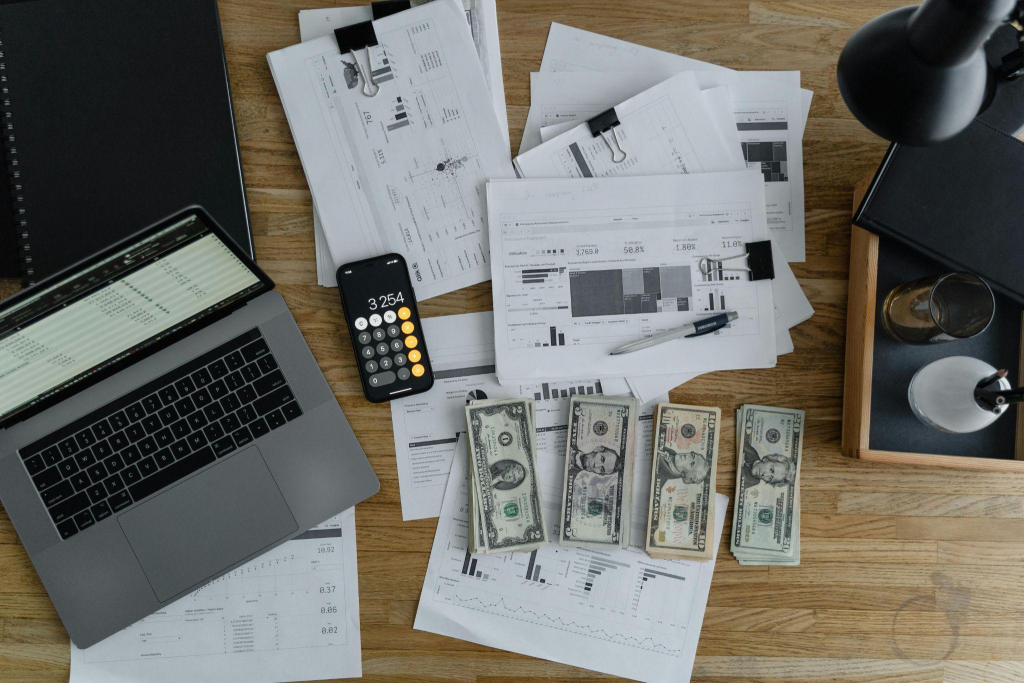 cash and calculator placed on the table