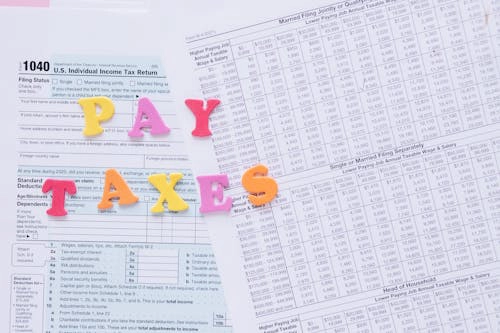 letters arranged to say ‘pay taxes’